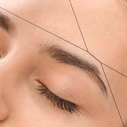 Close-up of eyebrow threading being performed at Divine Lotus beauty salon in Wolverhampton.