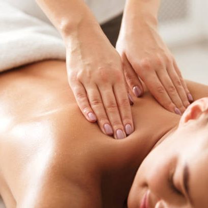 Woman receiving a relaxing Swedish back massage at Divine Lotus massage in Wolverhampton